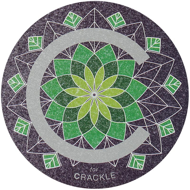 A Crackle surface with a big letter "C" and a decorative green mosaic behind the C.