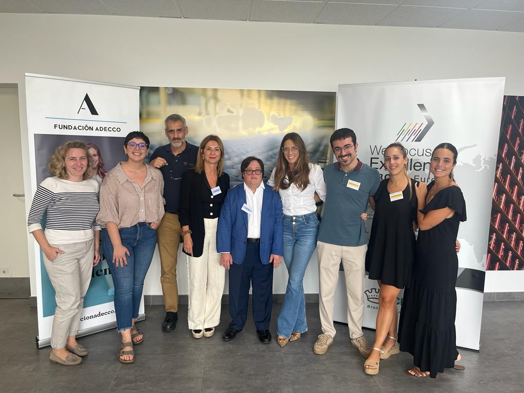 Several members of the Crown Cork Valencia team gather for a group photo.