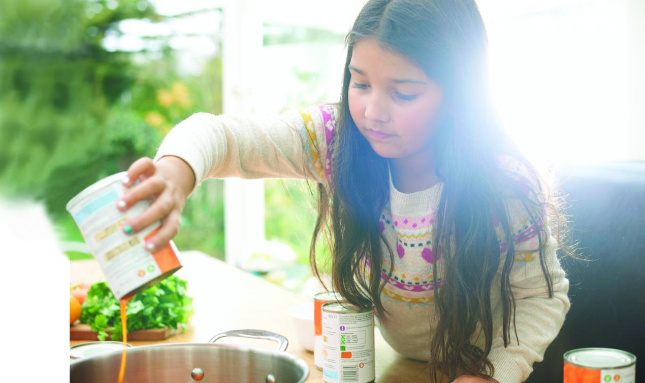 Young Girl Making Soup