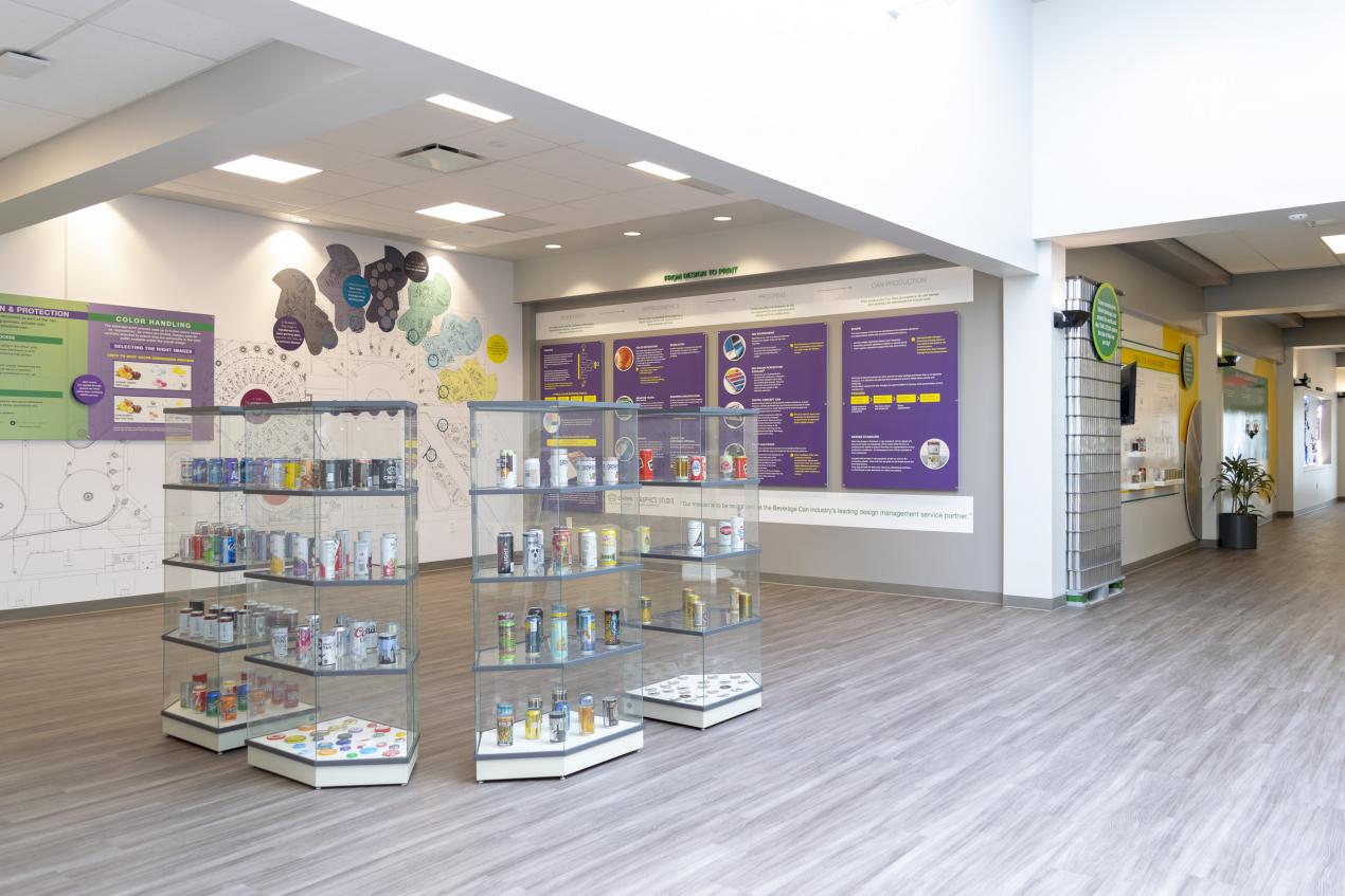 Office space featuring a display of different beverage can packaging types