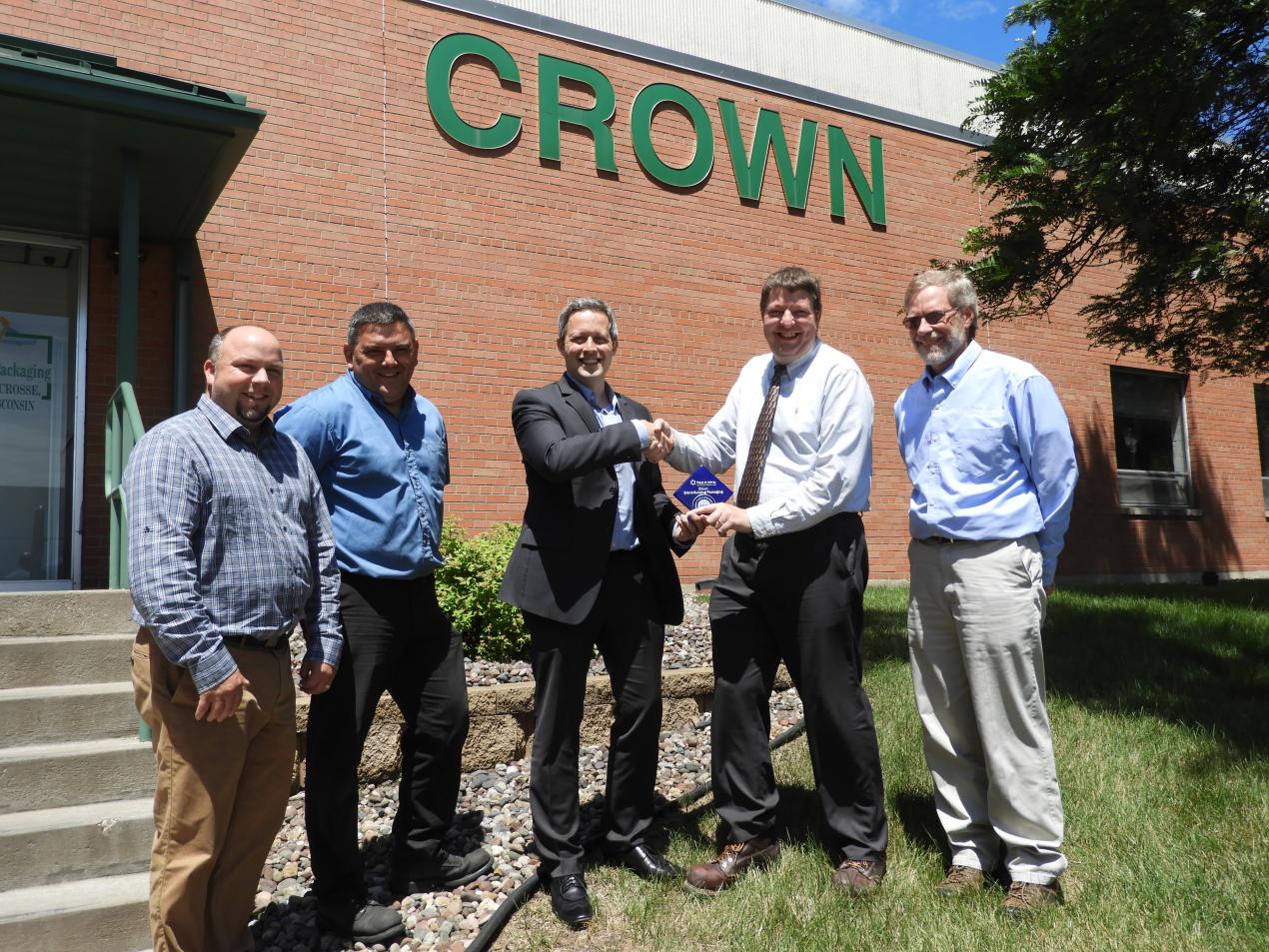 Pictured at the June 21, 2017 awards presentation (left to right) is Alex Lueck, Xcel Energy; Bill Clements, Crown Beverage Packaging; Chad Bulman, Focus on Energy; Chad Jacobsen, Crown Beverage Packaging; Randy Urness, Focus on Energy.