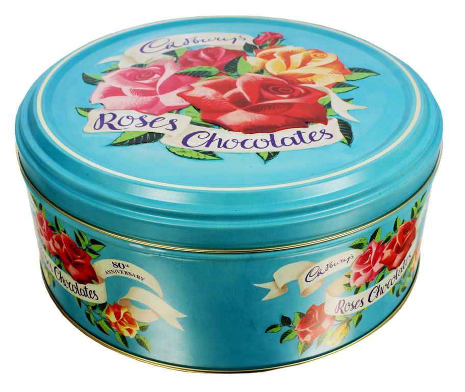 Light blue tin with red, pink, and yellow roses and Cadbury Roses Chocolates written across the top
