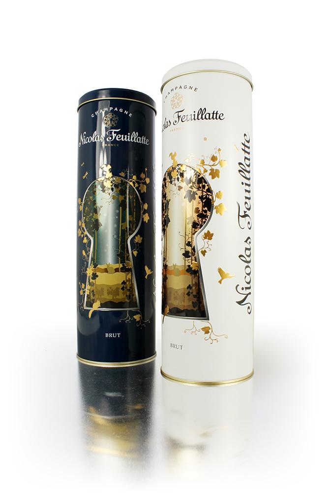 Two tall tins, one black and the other white, with Nicolas Feuillatte written on the site