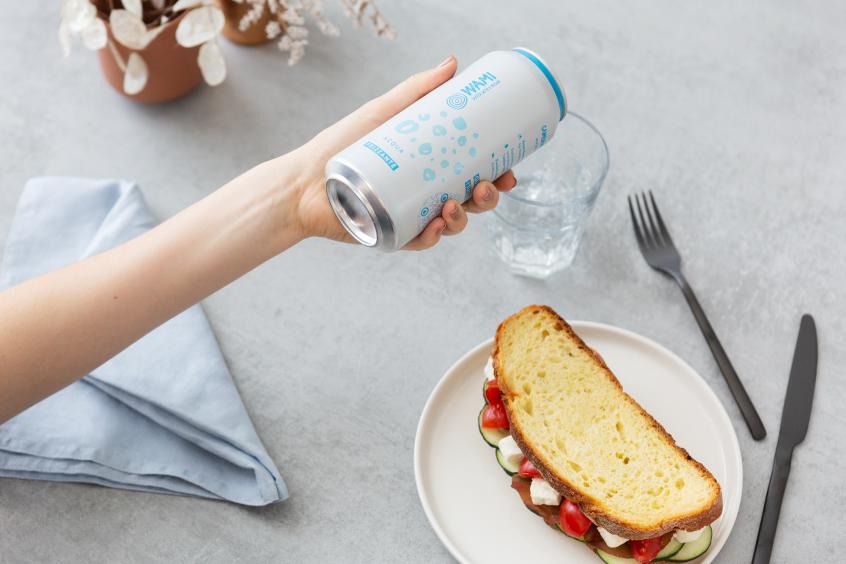 A picture of a can of water by WAMI, an Italian water brand