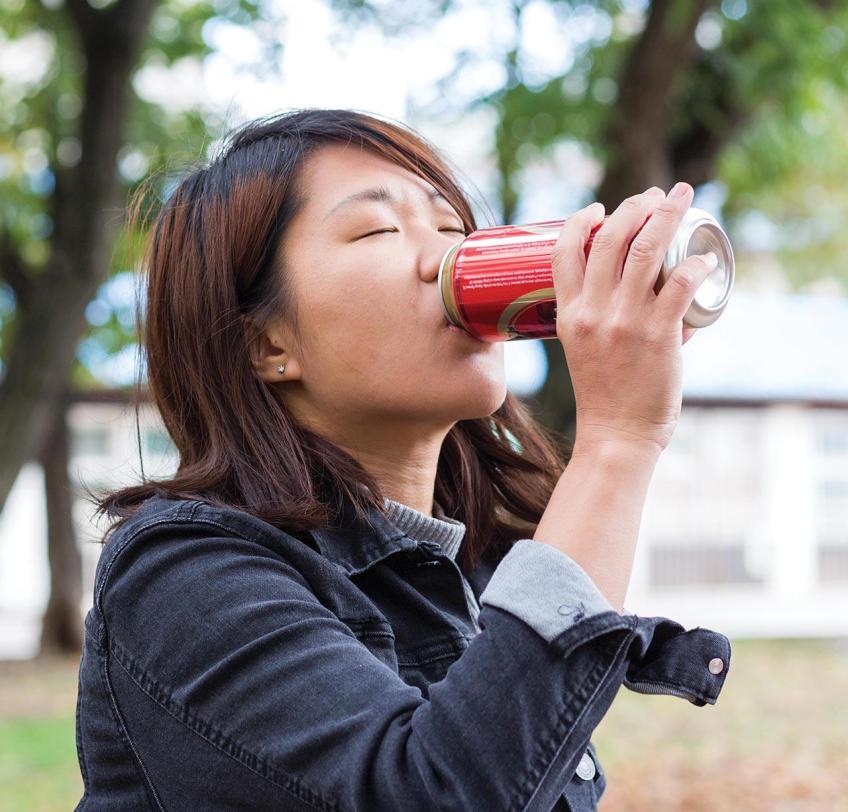 Woman drinking from Can